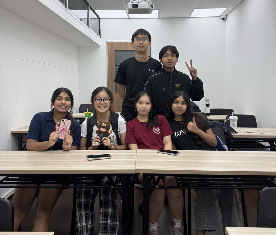 Students with their tutor in an Ember class