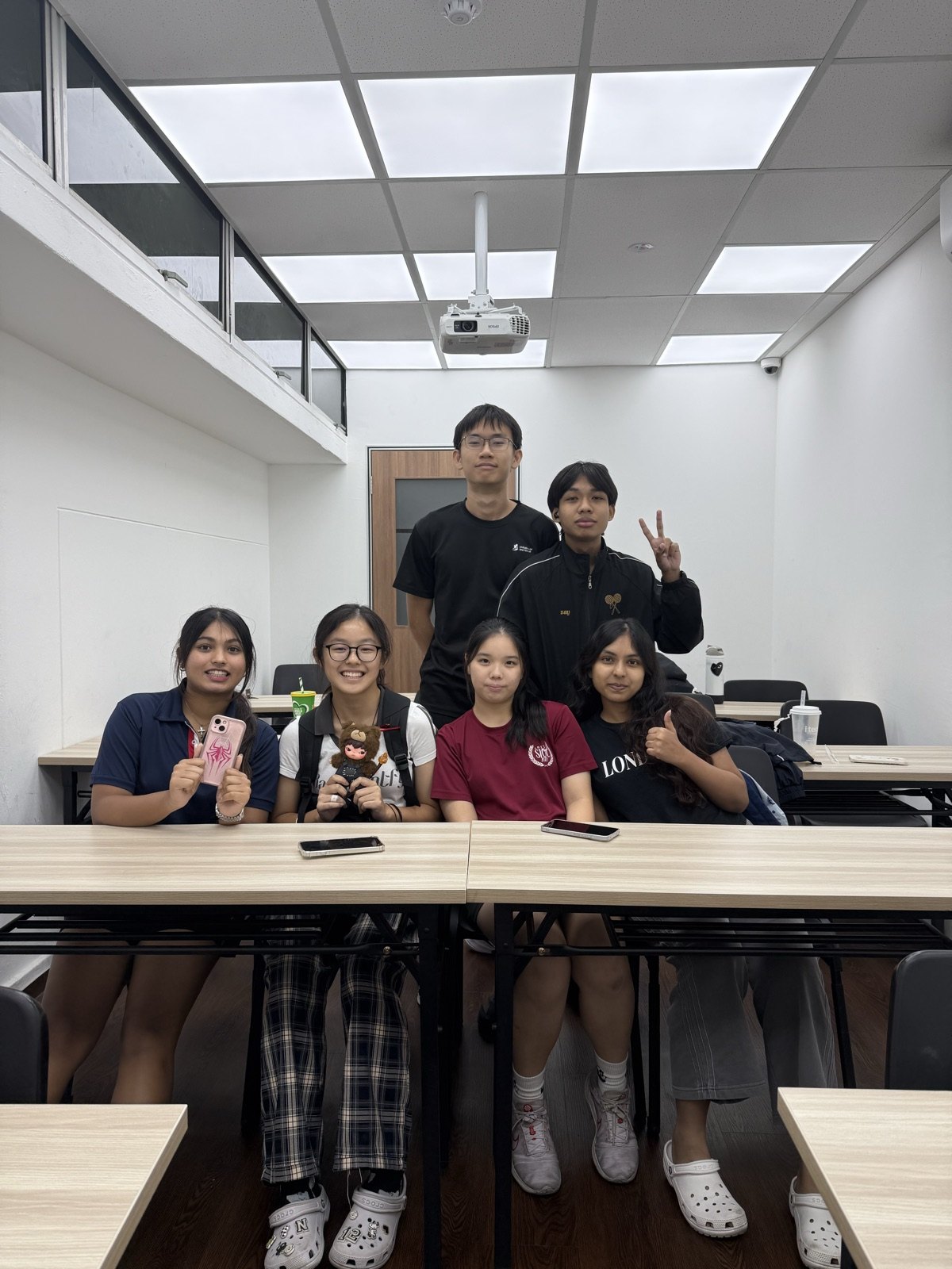 The MI PU1 H2 Chemistry class with their tutor at the Jurong East centre, where the class meets on Mondays